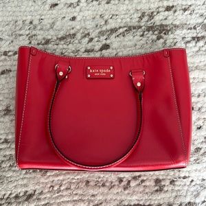 Coral/red Kate Spade bag.